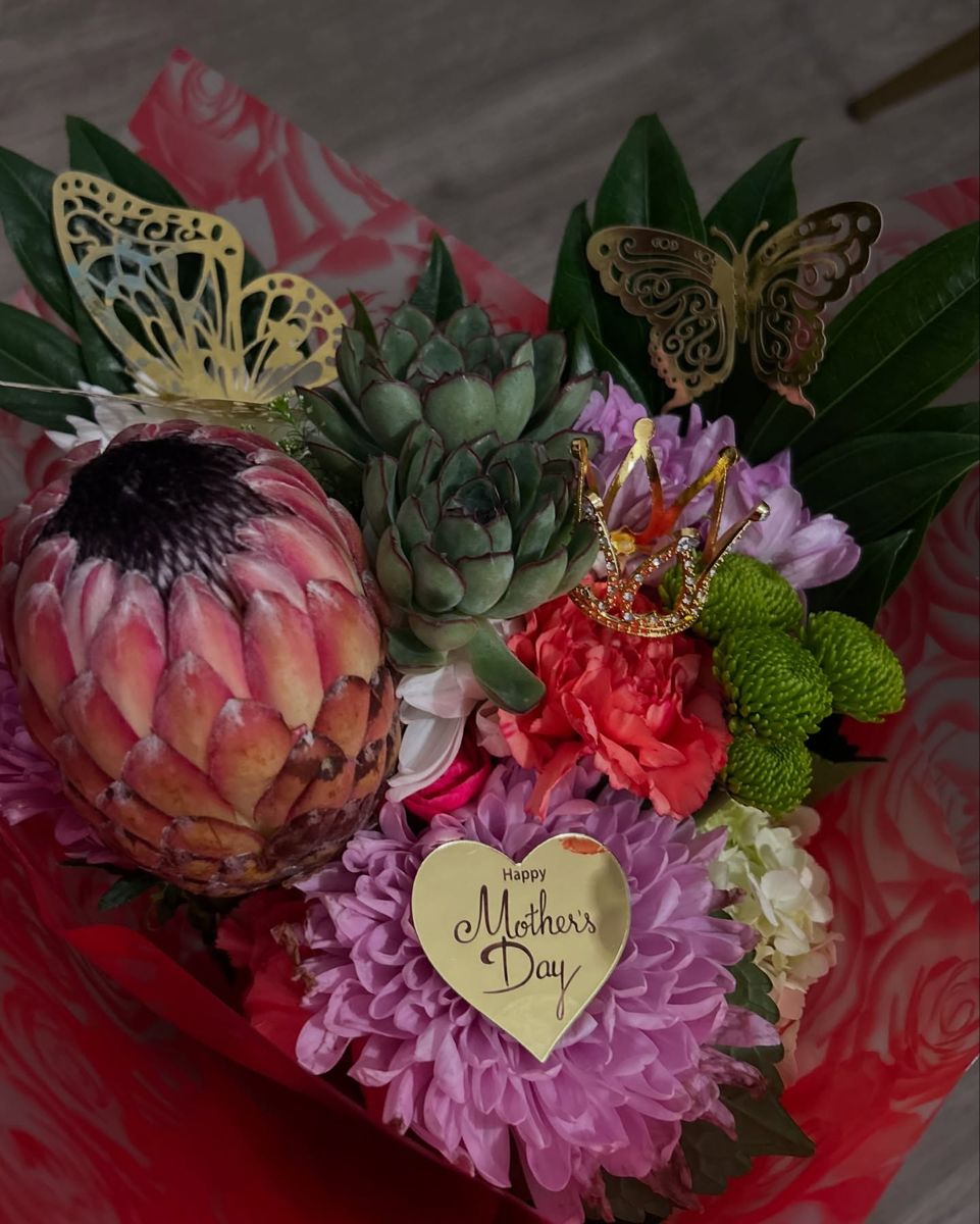 Mixed bouquet with king protea, succulents, mums and a Mother's Day heart